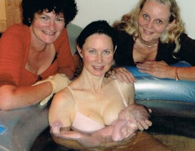 Doula and midwife at water birth.