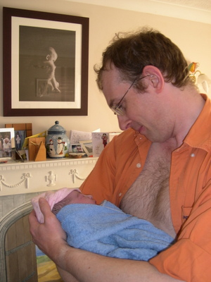 dad holding his newborn baby