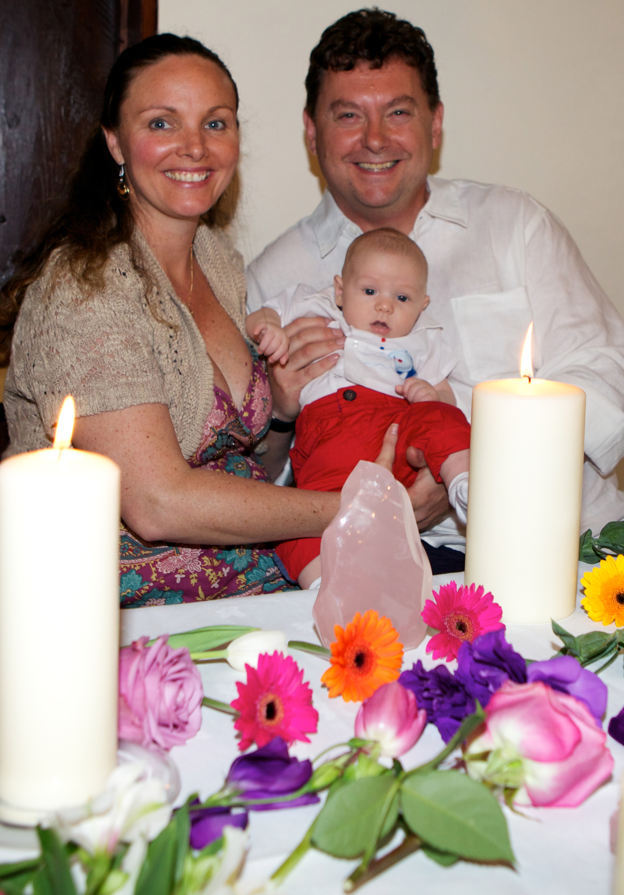mother, baby and father at baby naming ceremony